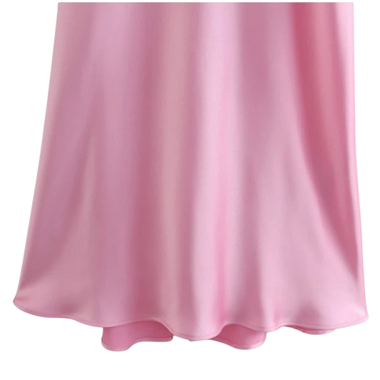 Juno Satin Slip Maxi Dress With Cutout Detail in pink. Features a cowl neckline, spaghetti straps, and a back cutout. Made from luxurious satin.